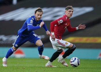 epa09192136 Leicester’s James Maddison (L) and Manchester United’s Brandon Williams (R) in action during the English Premier League soccer match between Manchester United and Leicester City in Manchester, Britain, 11 May 2021.  EPA/Dave Thompson / POOL EDITORIAL USE ONLY. No use with unauthorized audio, video, data, fixture lists, club/league logos or 'live' services. Online in-match use limited to 120 images, no video emulation. No use in betting, games or single club/league/player publications.
