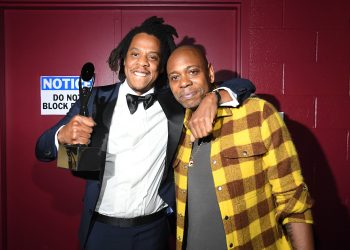 CLEVELAND, OHIO - OCTOBER 30: Jay-Z (L) and Dave Chappelle pose backstage during the 36th Annual Rock & Roll Hall Of Fame Induction Ceremony at Rocket Mortgage Fieldhouse on October 30, 2021 in Cleveland, Ohio. (Photo by Kevin Mazur/Getty Images for The Rock and Roll Hall of Fame )