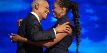 CHICAGO, ILLINOIS - AUGUST 20: Former U.S. President Barack Obama (L) greets former first lady Michelle Obama as he arrives to speak on stage during the second day of the Democratic National Convention at the United Center on August 20, 2024 in Chicago, Illinois. Delegates, politicians, and Democratic Party supporters are gathering in Chicago, as current Vice President Kamala Harris is named her party's presidential nominee. The DNC takes place from August 19-22. (Photo by Andrew Harnik/Getty Images)