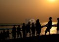 This is at Fort Prinzenstein, Keta. Some fisher folk drawing in the net of the day's catch. It was about 4 pm. Shot in 2015