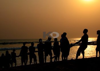 This is at Fort Prinzenstein, Keta. Some fisher folk drawing in the net of the day's catch. It was about 4 pm. Shot in 2015